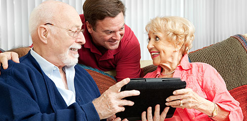 Senior living couple with nurse