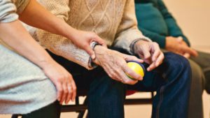 Caregiver lending a helping hand