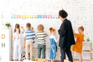 Students writing on board provided with money from grant funding